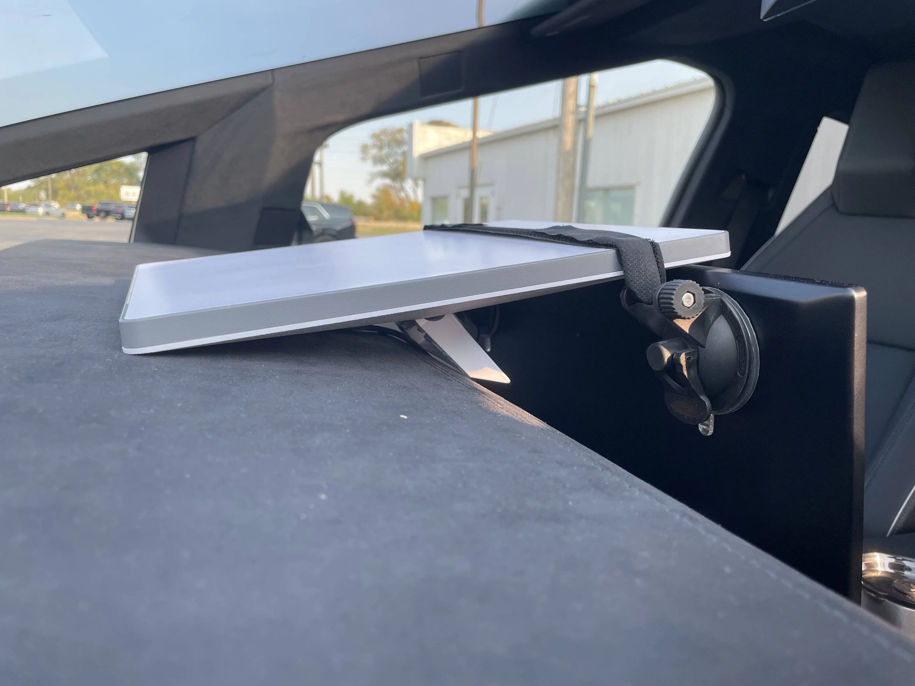 Tesla Cybertruck Starlink mini mount strapped down behind display screen — LATEST on what is working for me on my biz road trip IMG_1468
