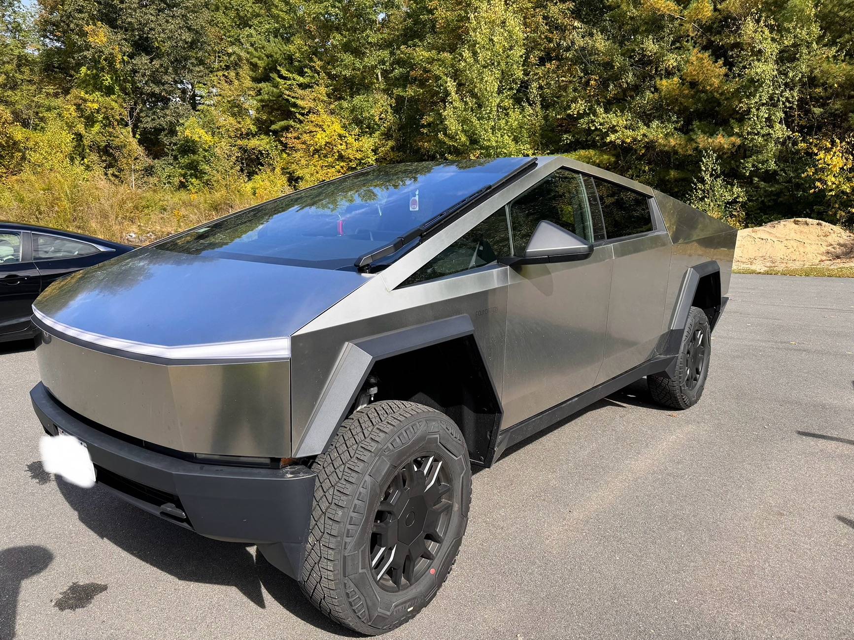 Tesla Cybertruck Park "Extract" vs "Entry". IMG_2153