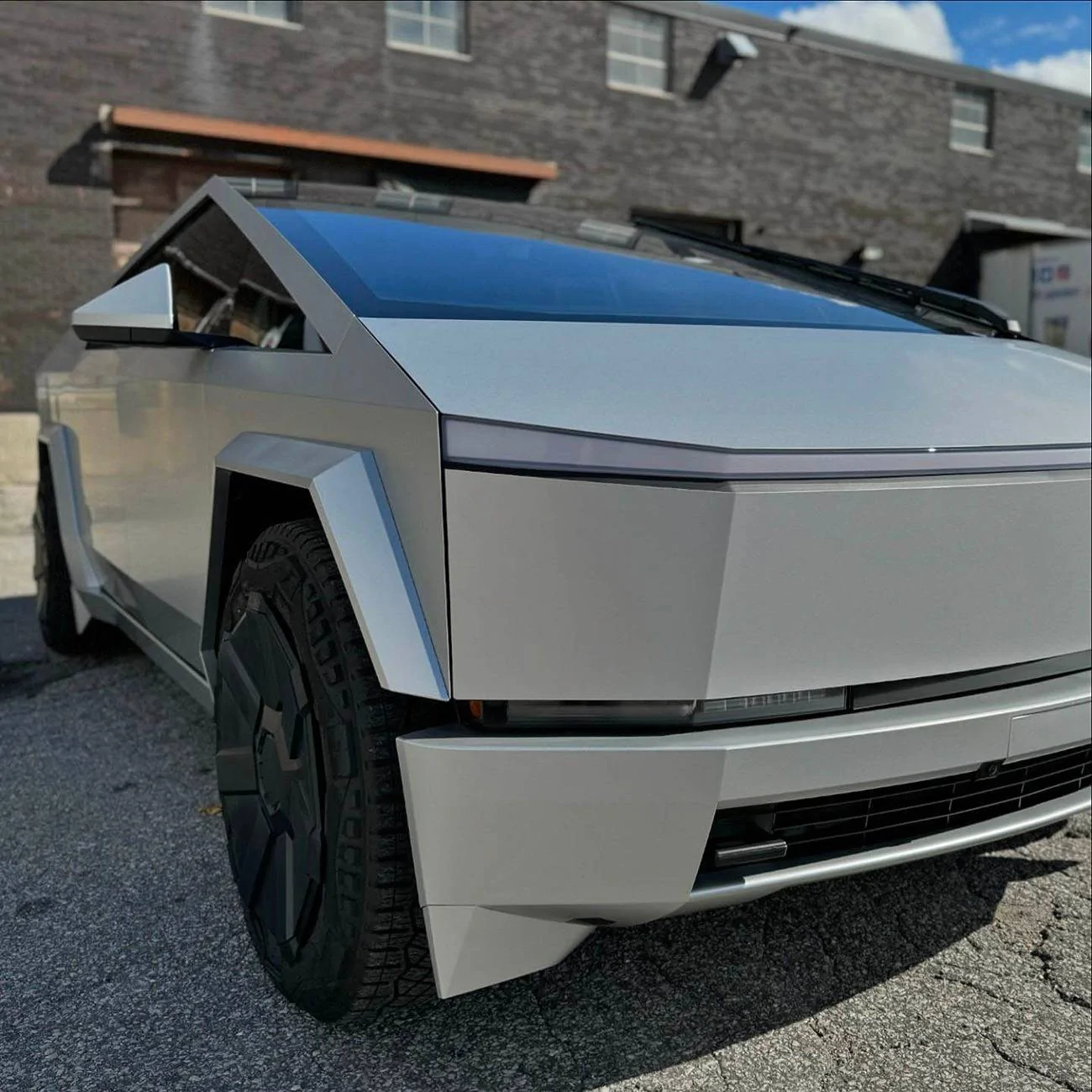 Tesla Cybertruck Cybertruck in 3M Satin Silver Aluminum Wrap + Painted Plastic Pumpers + Ceramic Coating Cybertruck 3M Satin Silver Aluminum Vinyl Wrap, Painted Plastic Bumpers, Ceramic Coating 3