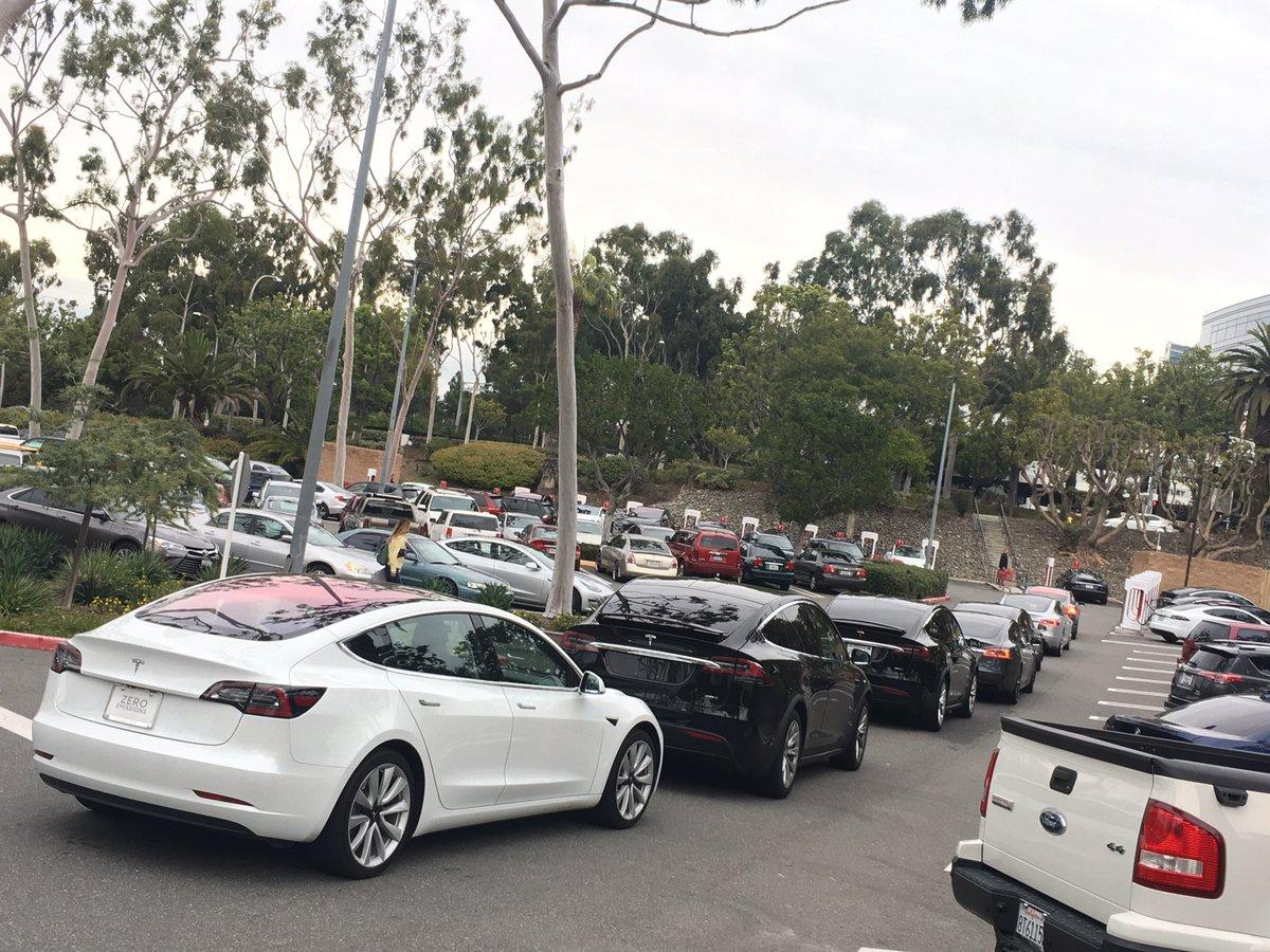 Tesla Cybertruck Tesla to potentially make $25 billion from sharing superchargers wait lin