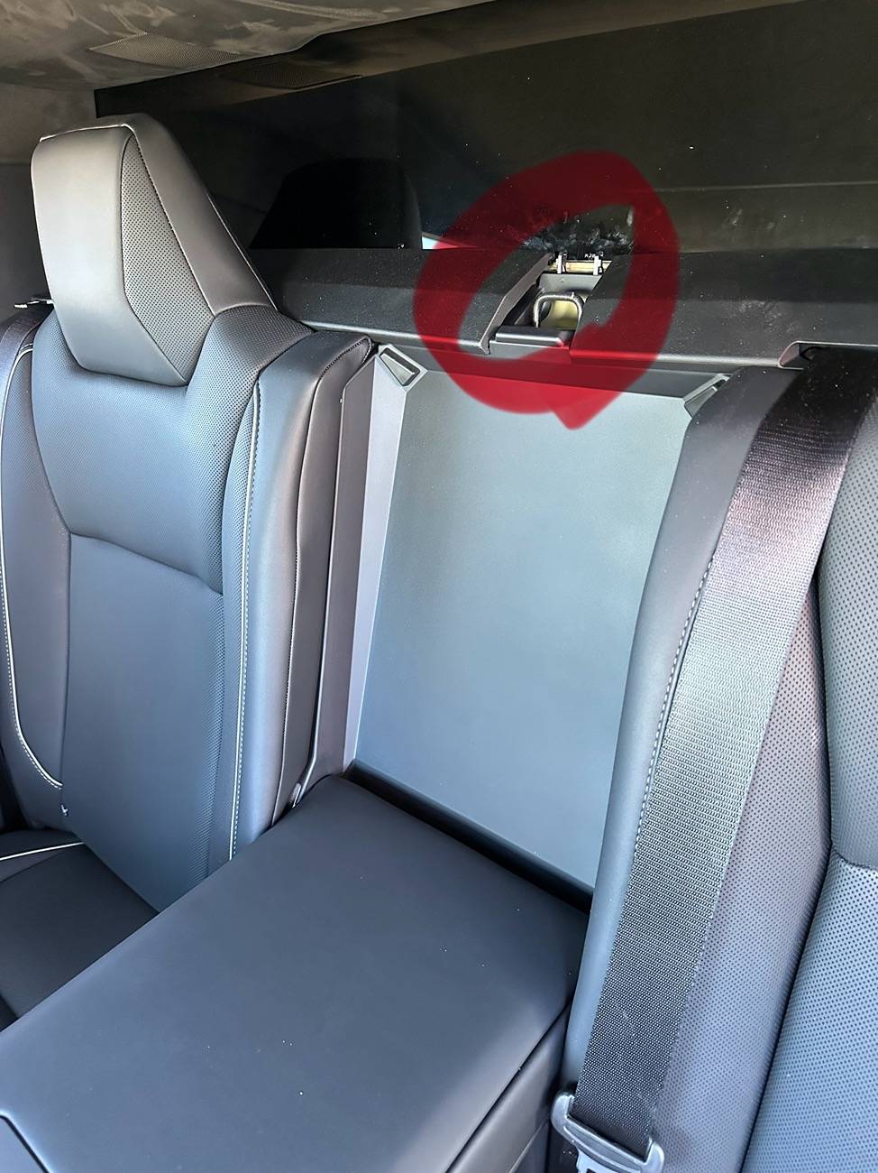 Tesla Cybertruck Someone accidentally pulled the cover off part of the back seat… what is this? IMG_2460