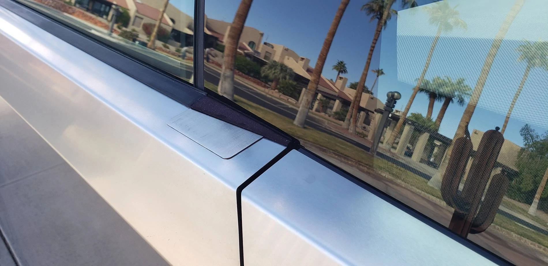 Tesla Cybertruck Cybertruck side mirror vs Garage Door. How much to fix side mirror? Mirror delet