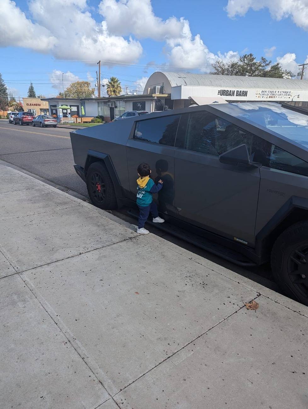 Tesla Cybertruck Cybertruck seems a bit higher for kid WhatsApp Image 2024-11-19 at 2.25.19 PM