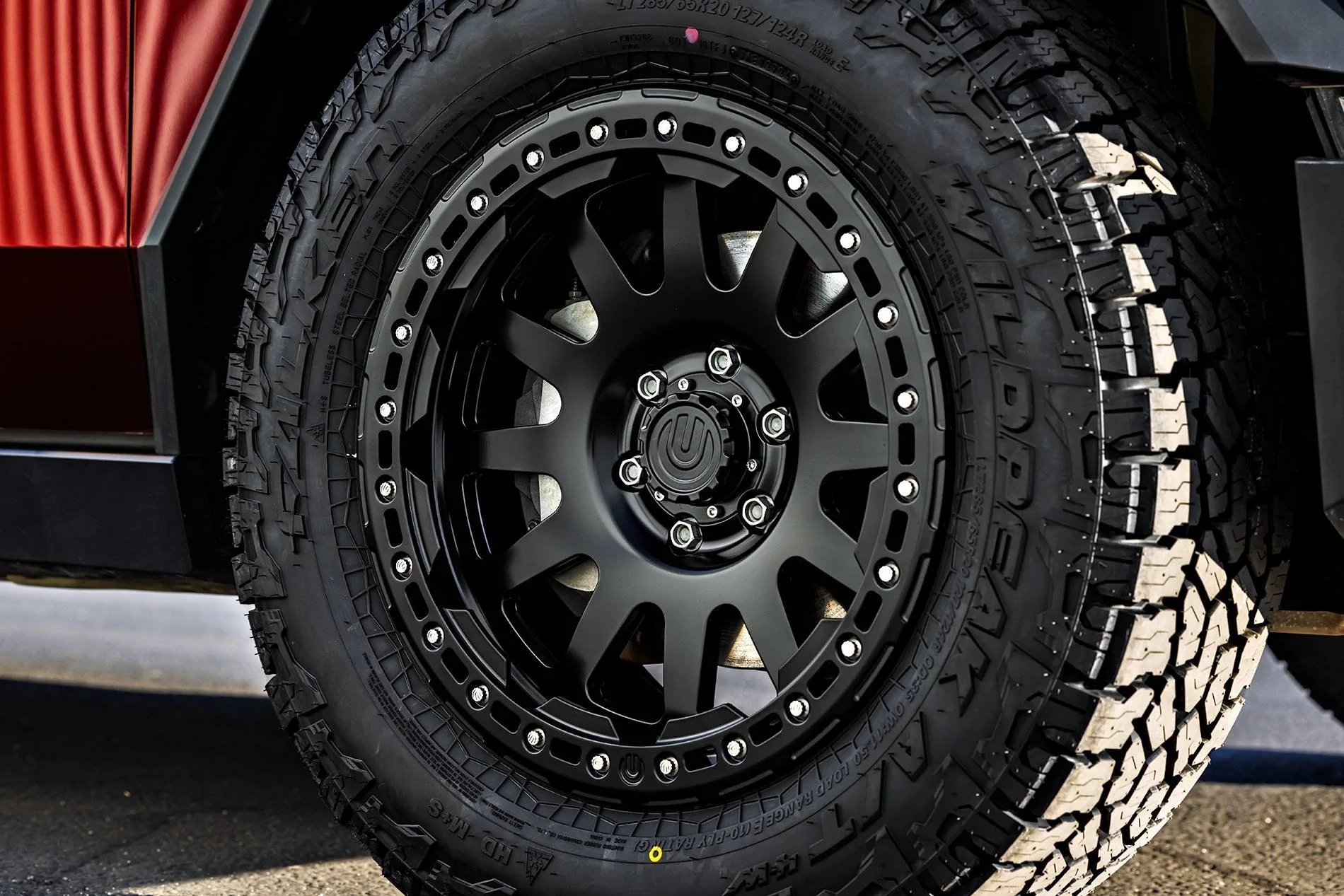 Tesla Cybertruck Customer Highlight - Assassin Red Cybertruck Build Tesla Cybertruck Assassin Red Wrap 20 inch Beadlock UP-03 Forged Wheels Roof Rails MOLLE Pan
