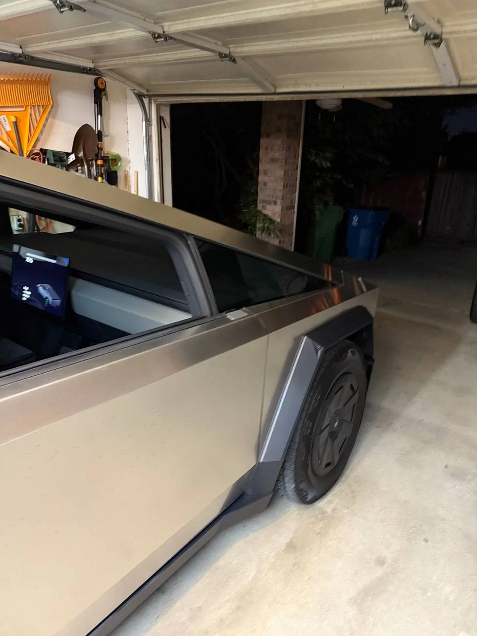 Tesla Cybertruck Cybertruck side mirror vs Garage Door. How much to fix side mirror? IMG_3053