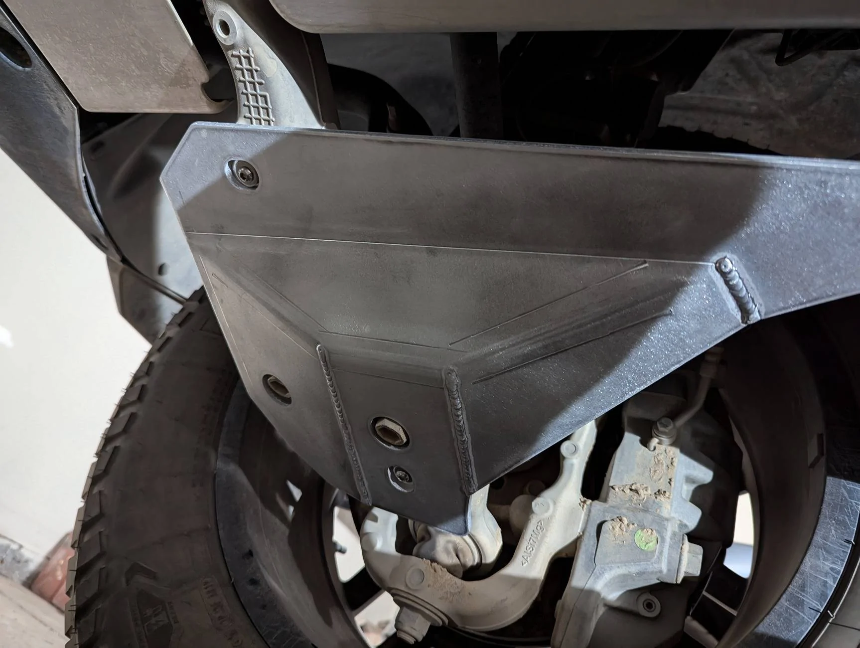 Tesla Cybertruck Review: CybertruckCo front control arm armor PXL_20241122_013048051