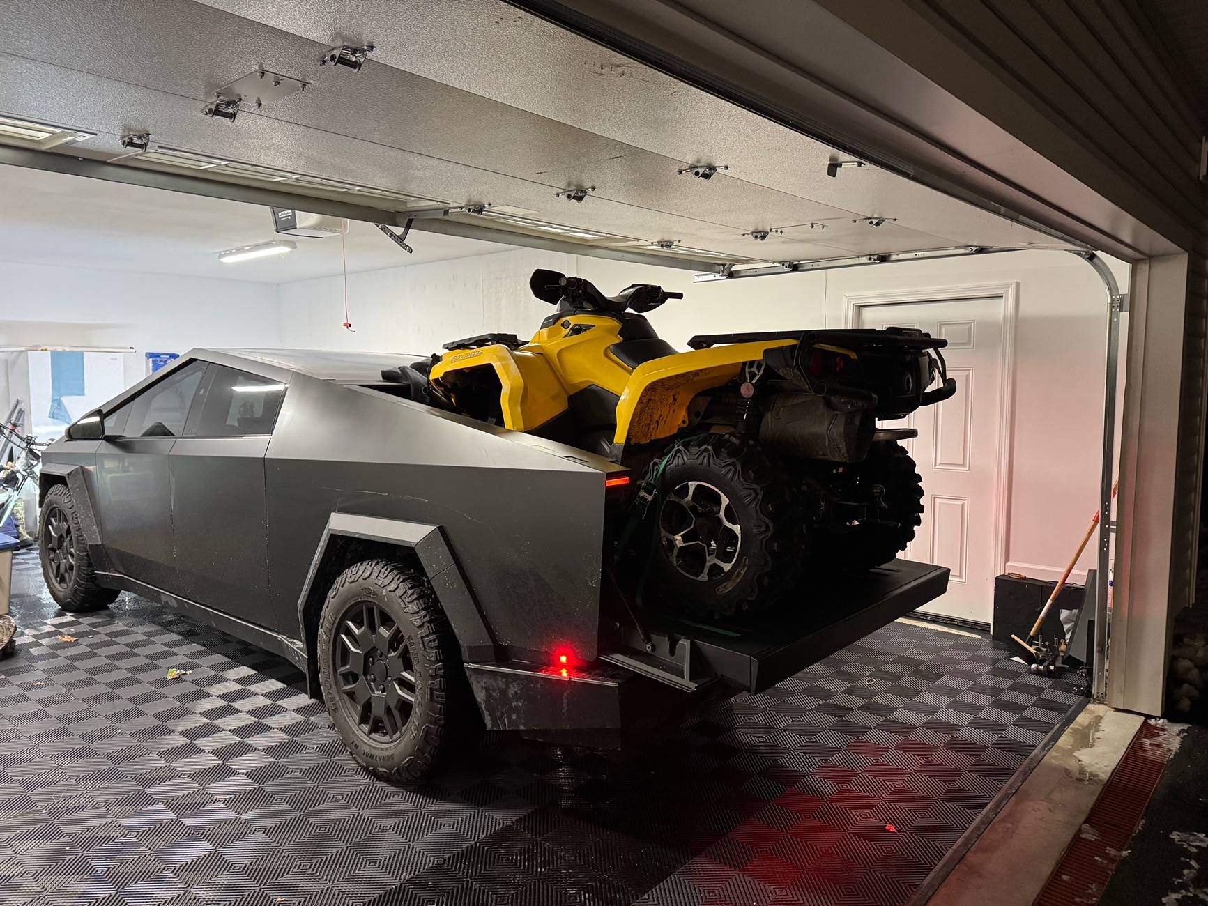 Tesla Cybertruck Cybertruck Tailgate Ramp used for loading ATV onto bed IMG_1590