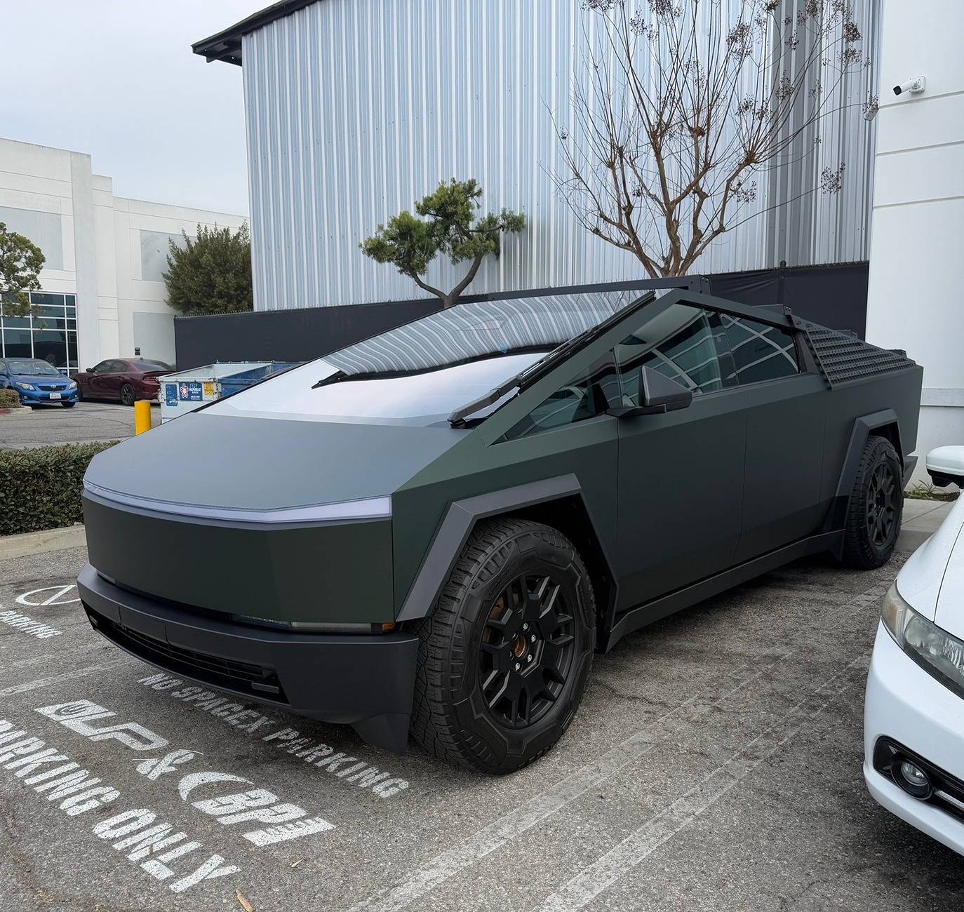 Tesla Cybertruck Customer Cybertruck in PURE PPF Forest Green Wrap, Gyeon Ceramic Coat, UP MOLLE Sails and Roof Racks 472790077_10162810063594673_2412617243627681140_n
