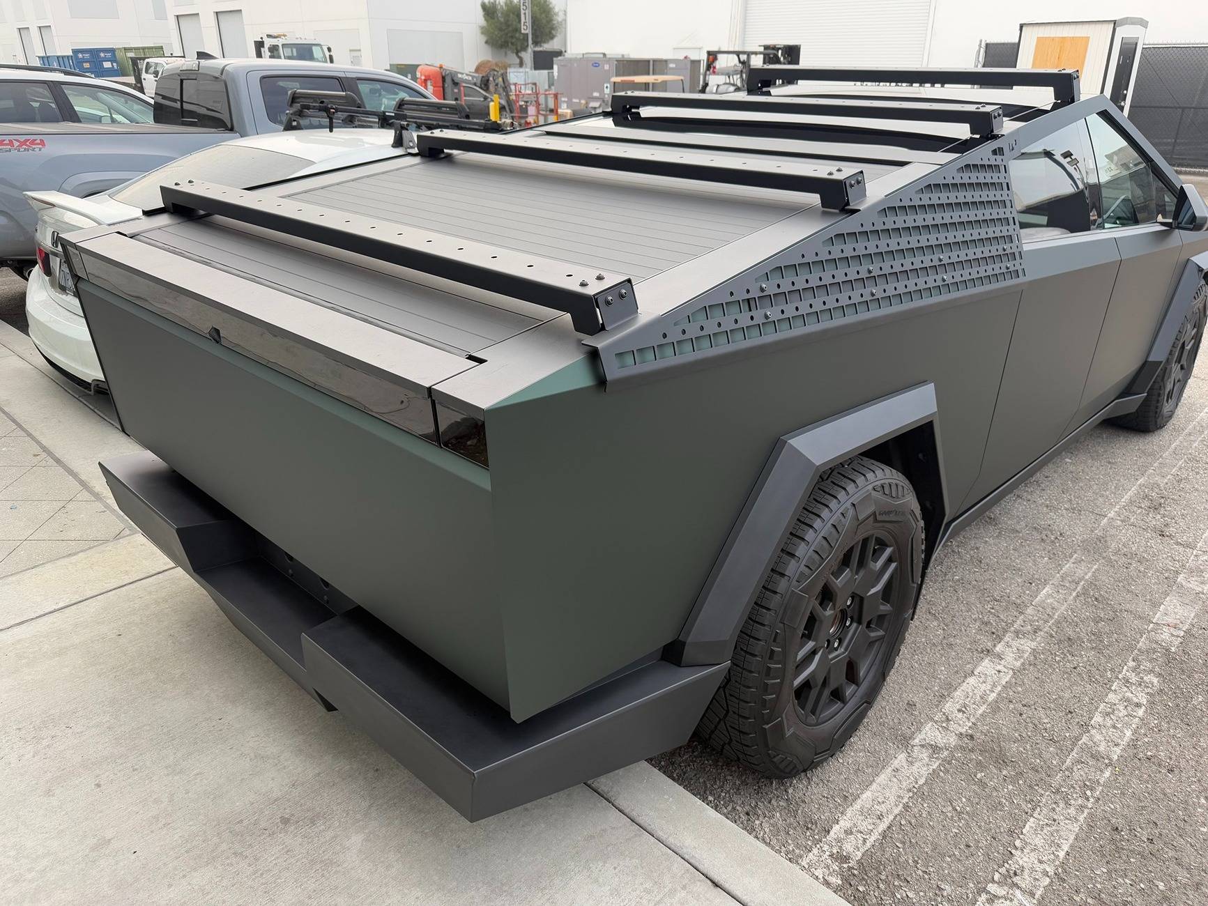 Tesla Cybertruck Customer Cybertruck in PURE PPF Forest Green Wrap, Gyeon Ceramic Coat, UP MOLLE Sails and Roof Racks 472669633_10162810059204673_7493948312048093973_n