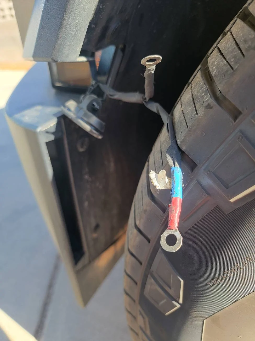 Tesla Cybertruck Wire in Front Left Wheel Well with Rubber Plug 1000003267