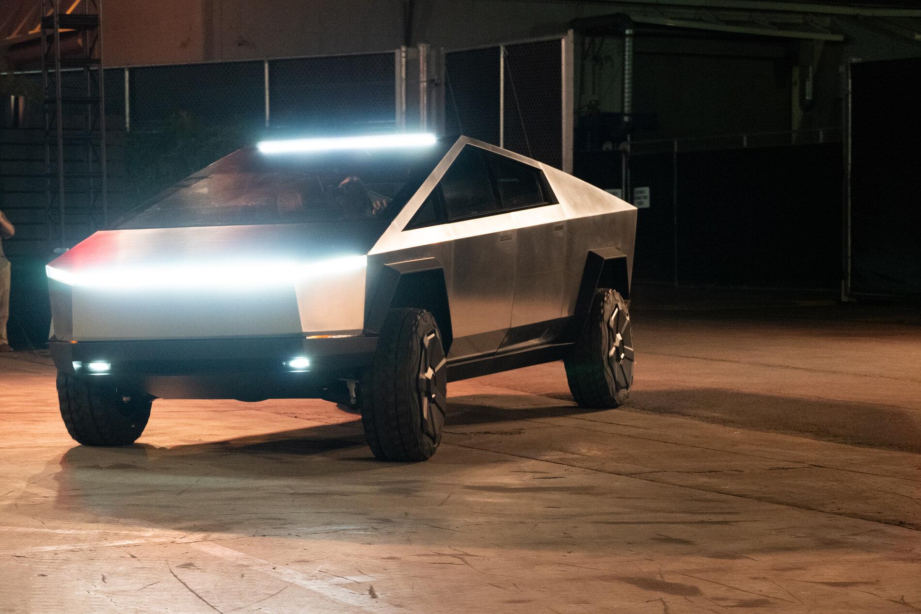 Tesla Cybertruck Tell us in 50,000 words or less why you're so excited about the Cybertruck tesla-cybertruck-turning-for-lights