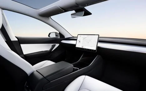Tesla Cybertruck Tesla’s $25k car gets update on its final name, options, and potential release date tesla-autonomy-day-468x292