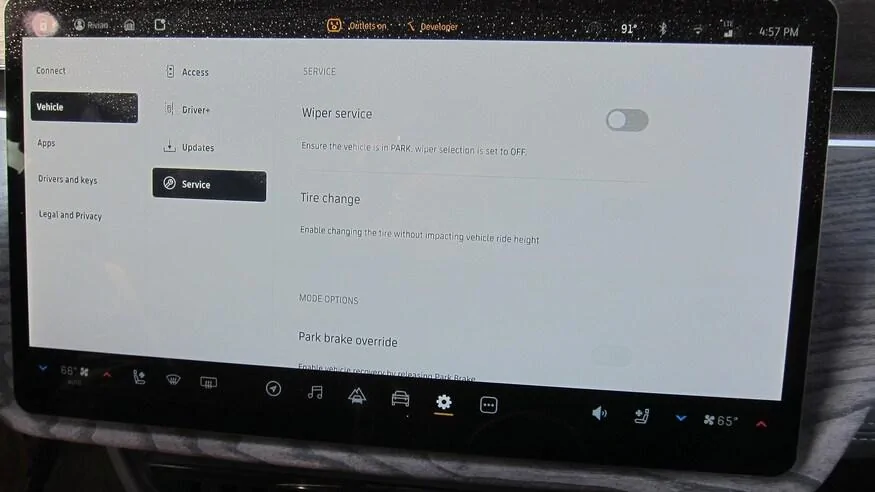 Tesla Cybertruck MotorTrend: 2022 Rivian R1T Spare Tire Explained: Fixing Flats Just Got Easier 2022-Rivian-R1T-Spare-Tire-Explained-18