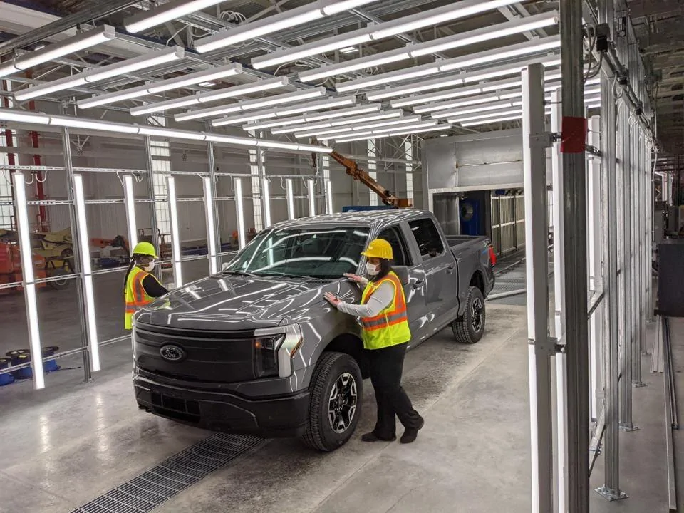 Tesla Cybertruck Rivian Starts shipping to Customer https---specials-images.forbesimg.com-imageserve-61439b613b0eed02cae10626-Workers-at-Ford-s-R