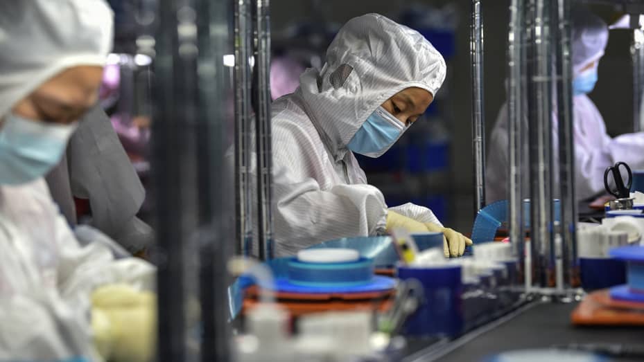 Tesla Cybertruck Some Apple, Tesla suppliers suspend production in China amid power pinch 28-1632701320216-gettyimages-1235264568-AFP_9MV6WK