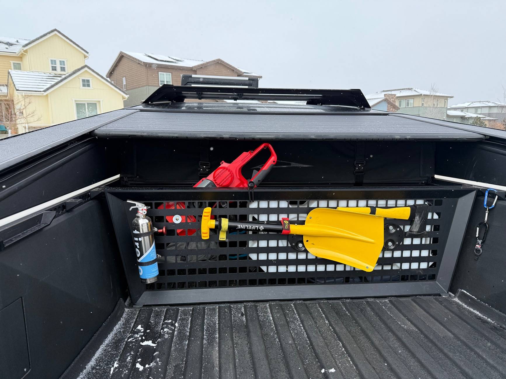 Tesla Cybertruck Chainsaw mount on cargo divider IMG_5517