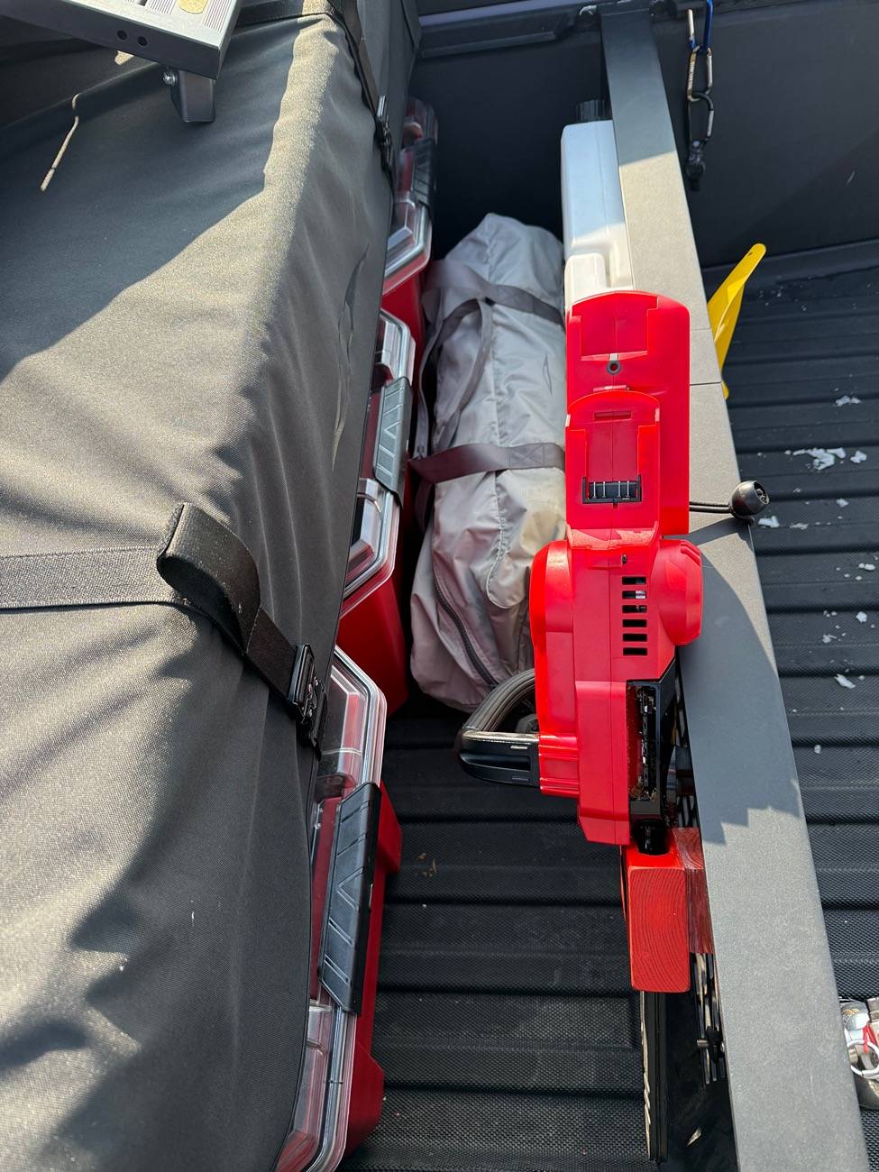 Tesla Cybertruck Chainsaw mount on cargo divider IMG_5540