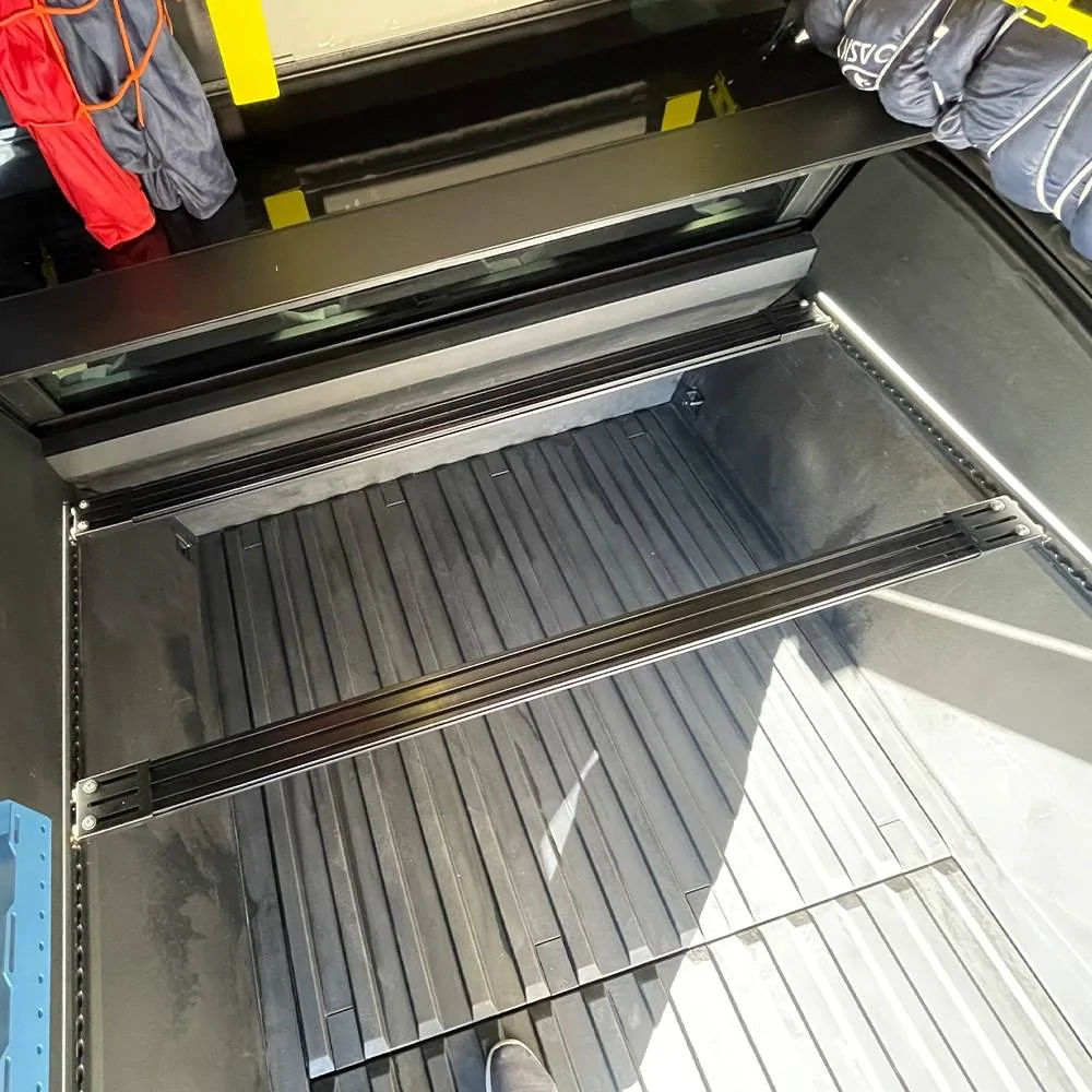 Tesla Cybertruck Cyber Tent Style - Using RTT mounted in truck bed tesla-cybertruck-bed-crossbars-from-cybertruckco-2