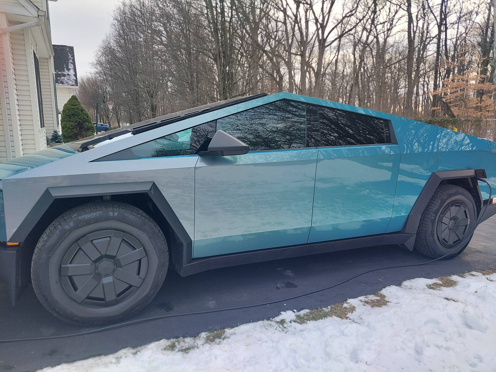 Tesla Cybertruck Getting cybertruck wrapped. Undecided on vinyl wrap / ppf. Leaning black but unsure of gloss, satin, or matte and which brand, need help! Cybertruck2