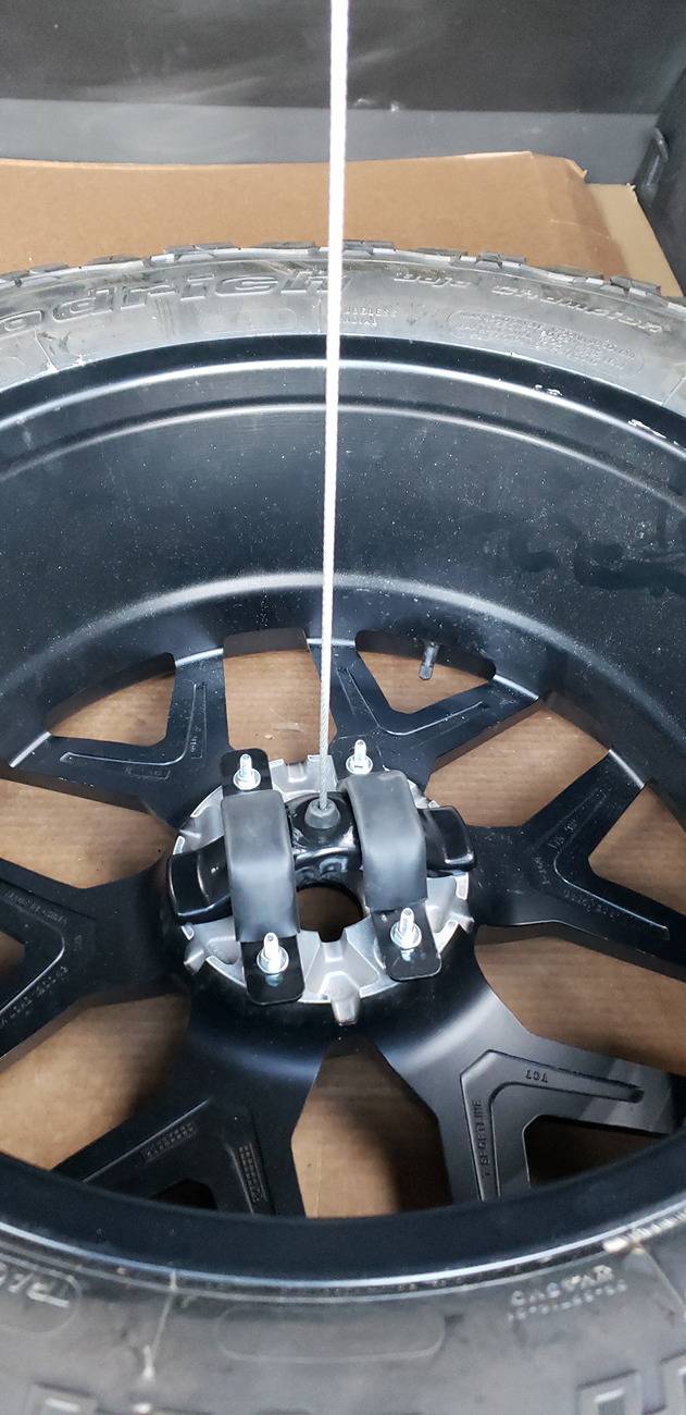 Tesla Cybertruck How I Carry a Spare When Off-road Adventuring -- Mounted to Underside of Bed Rack Hoist Connection