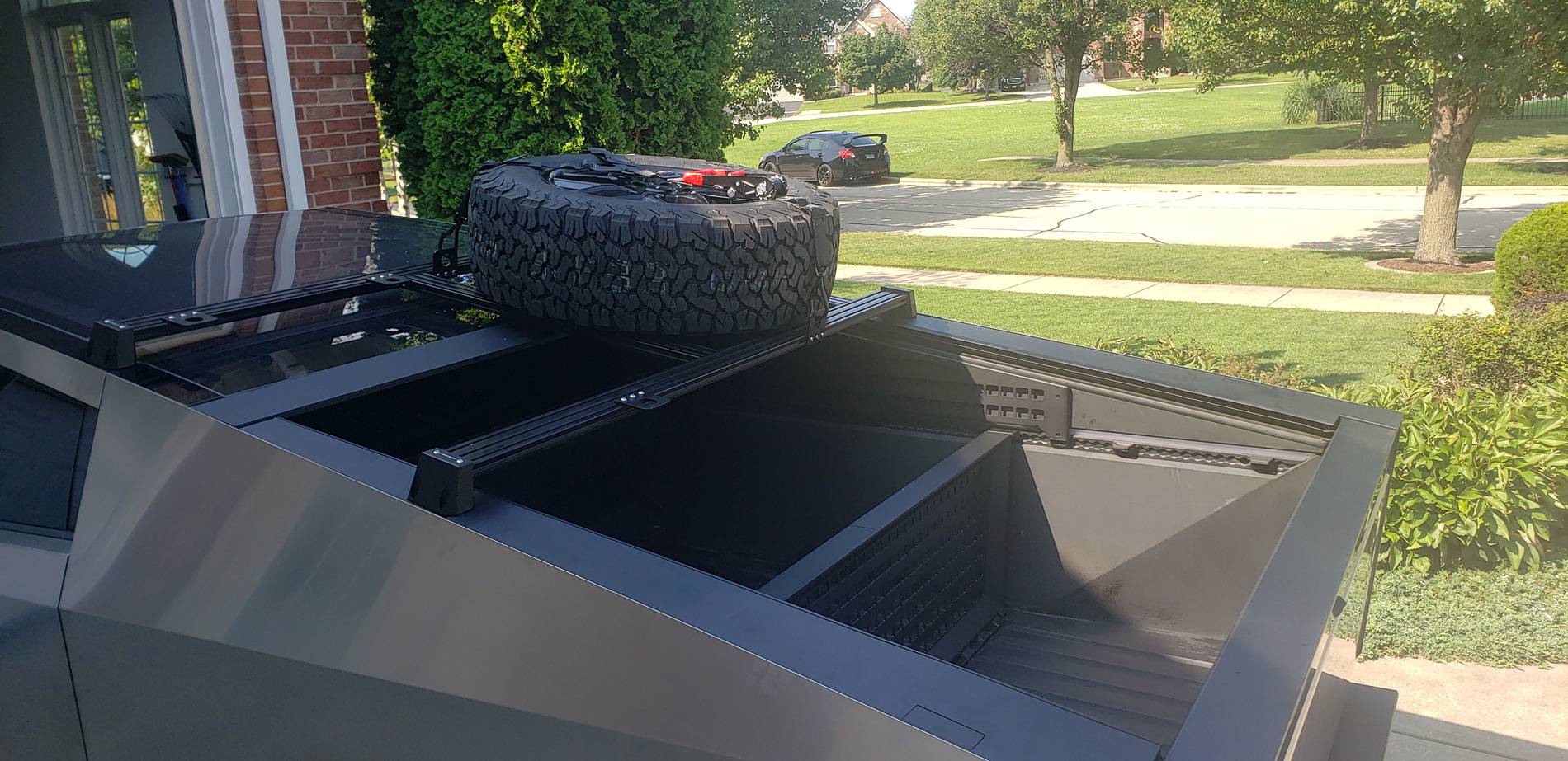 Tesla Cybertruck How I Carry a Spare When Off-road Adventuring -- Mounted to Underside of Bed Rack Roof Rack 1