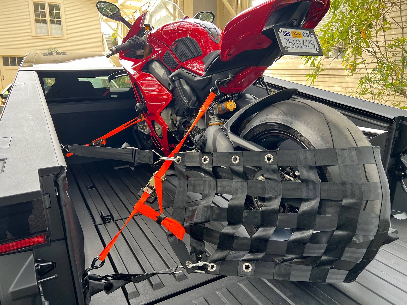 Tesla Cybertruck Ducati Panigale successfully loaded in CT! Post your motorcycles in bed IMG_8619