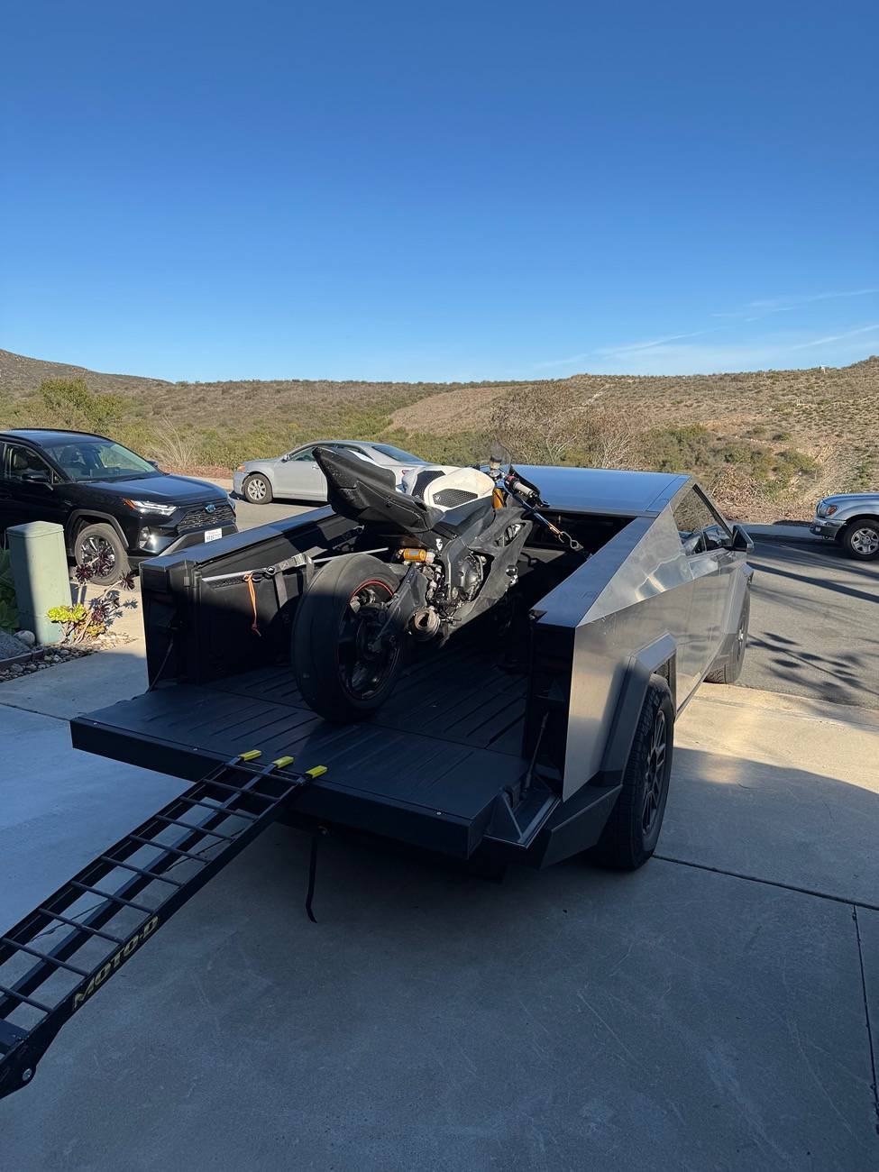 Tesla Cybertruck Ducati Panigale successfully loaded in CT! Post your motorcycles in bed IMG_1720