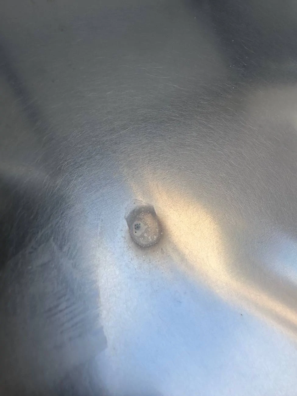 Tesla Cybertruck Rust? Hard water? Rail dust showing up 6 months later? I’m lost. IMG_1372