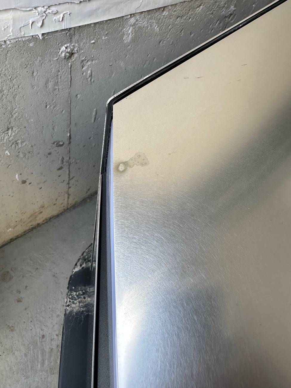 Tesla Cybertruck Rust? Hard water? Rail dust showing up 6 months later? I’m lost. IMG_1369