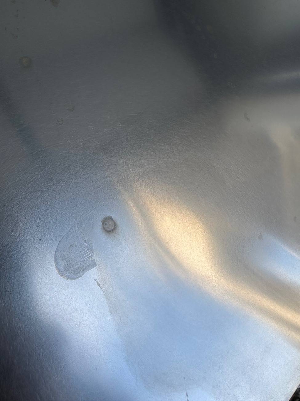 Tesla Cybertruck Rust? Hard water? Rail dust showing up 6 months later? I’m lost. IMG_1371