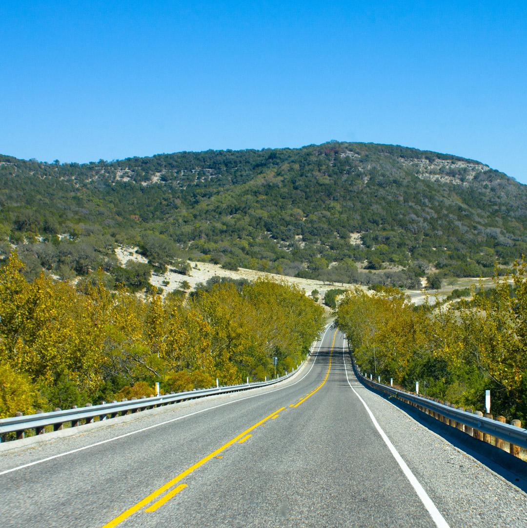 Tesla Cybertruck Elon just announced Tesla HQ will move to Austin! TX_HillCountryRoad_eyemrs-iStock-487883137