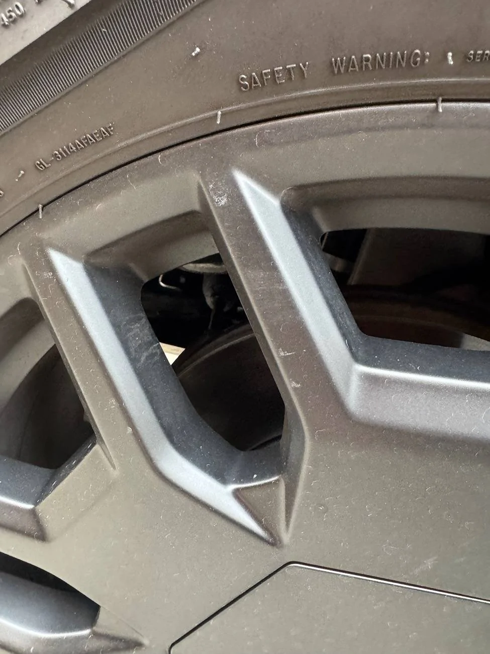 Tesla Cybertruck New wheel covers scratched all 4 of my rims IMG_7882