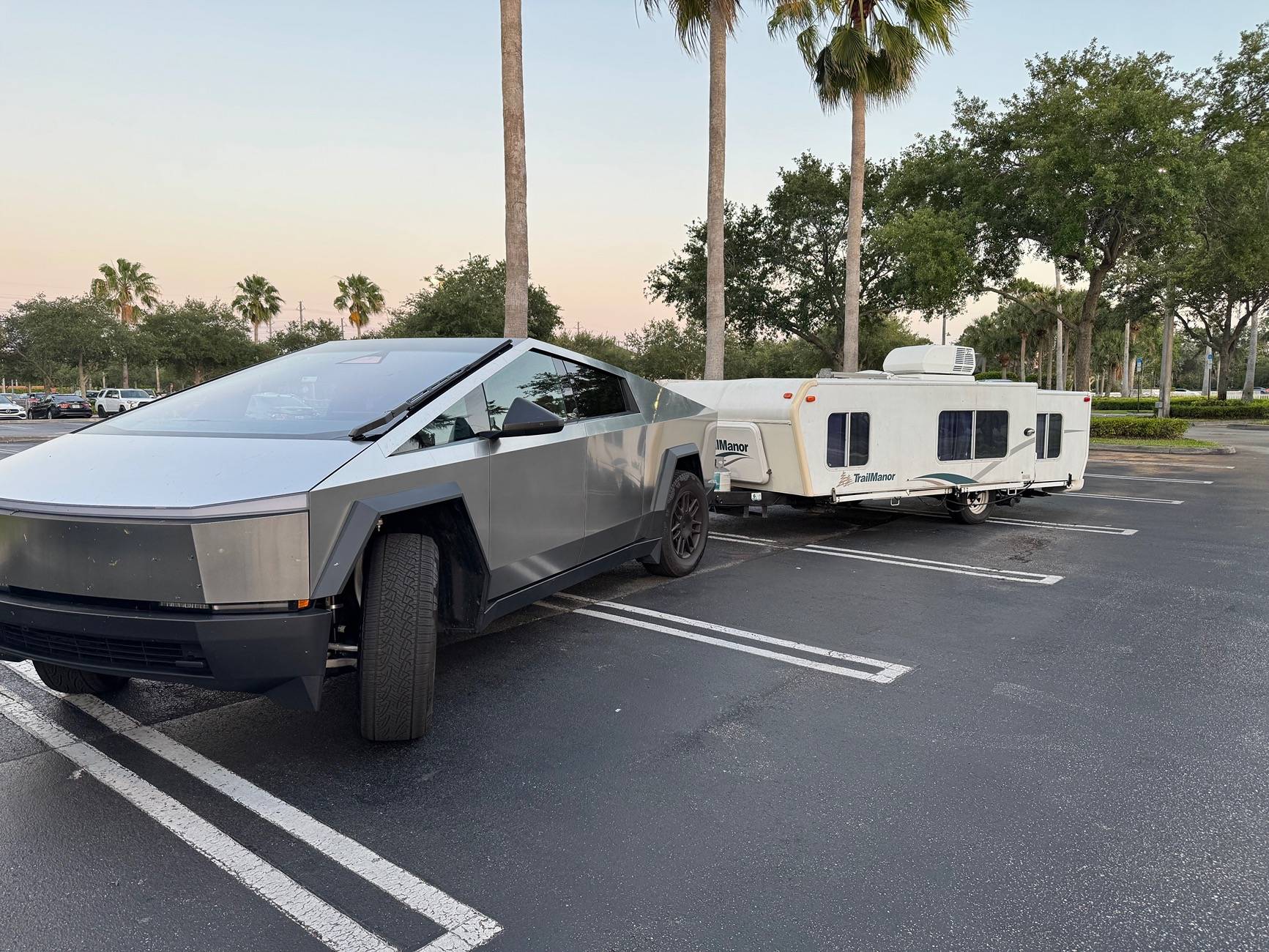 Tesla Cybertruck Just got a Trailmanor hard shell pop up camper -- towing stats IMG_2119
