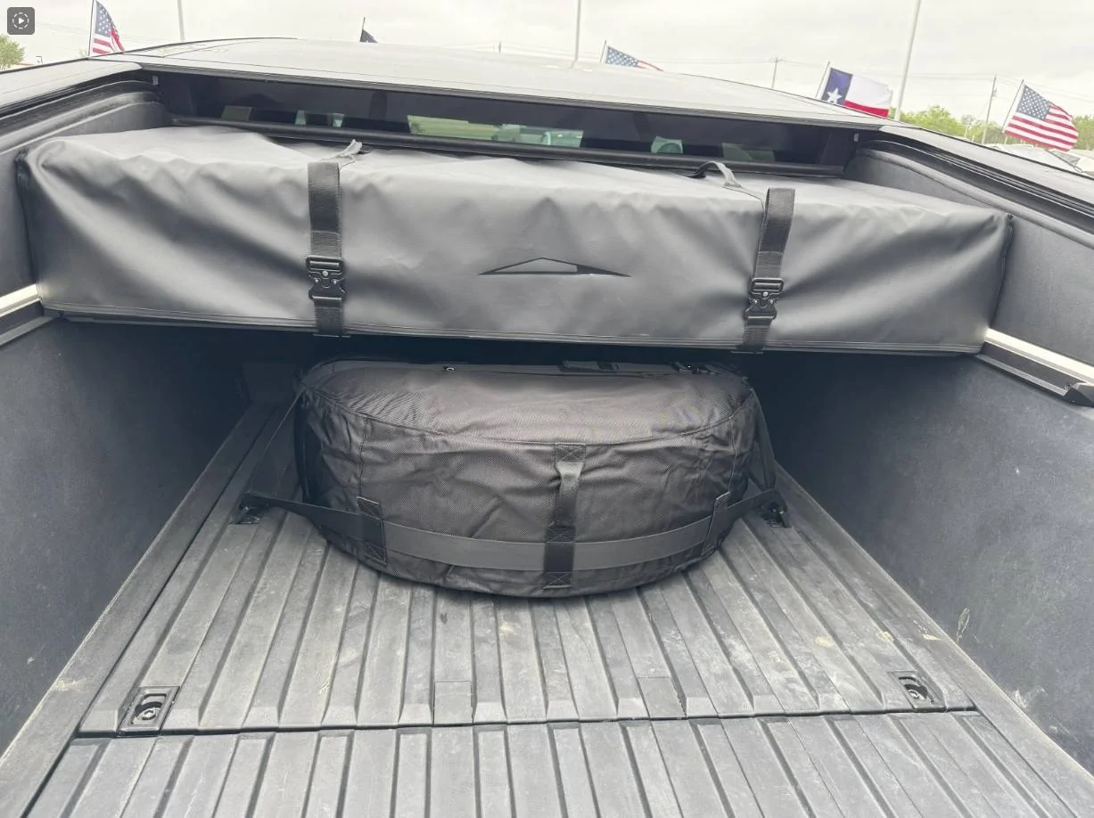 Tesla Cybertruck Stored the CyberTent and spare tire in the bed CyberTent and spare tire stowed in bed