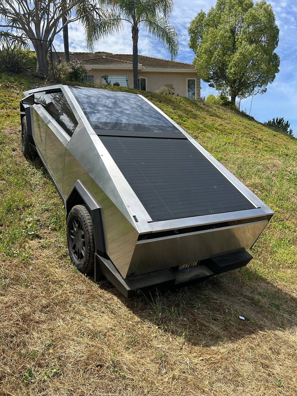 Tesla Cybertruck Aftermarket Sail Applique and Tailgate Cap in stainless steel for Cybertruck by JAM Specialty Products IMG_6398