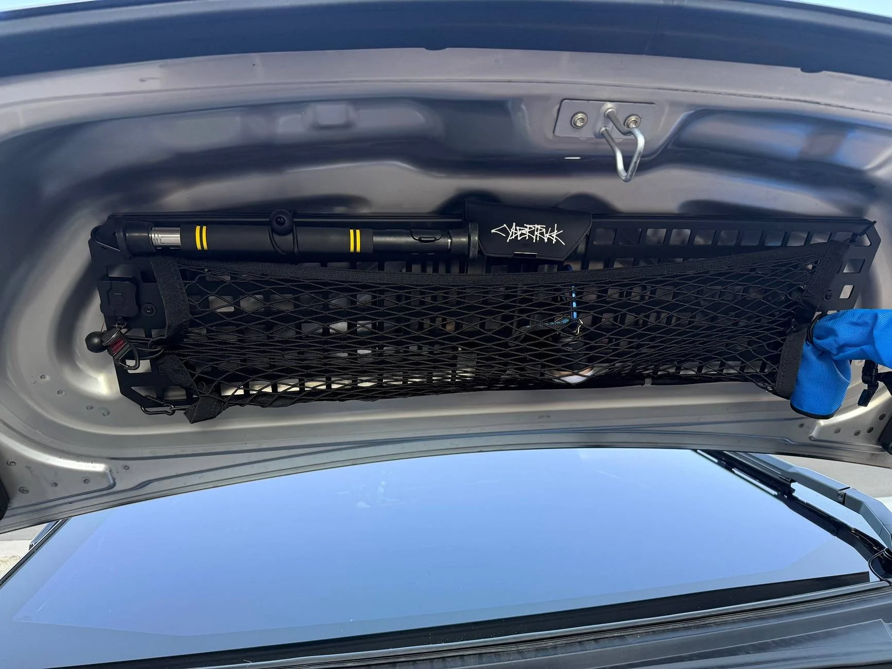 Tesla Cybertruck How does your frunk motor behave with molle panels? IMG_3130