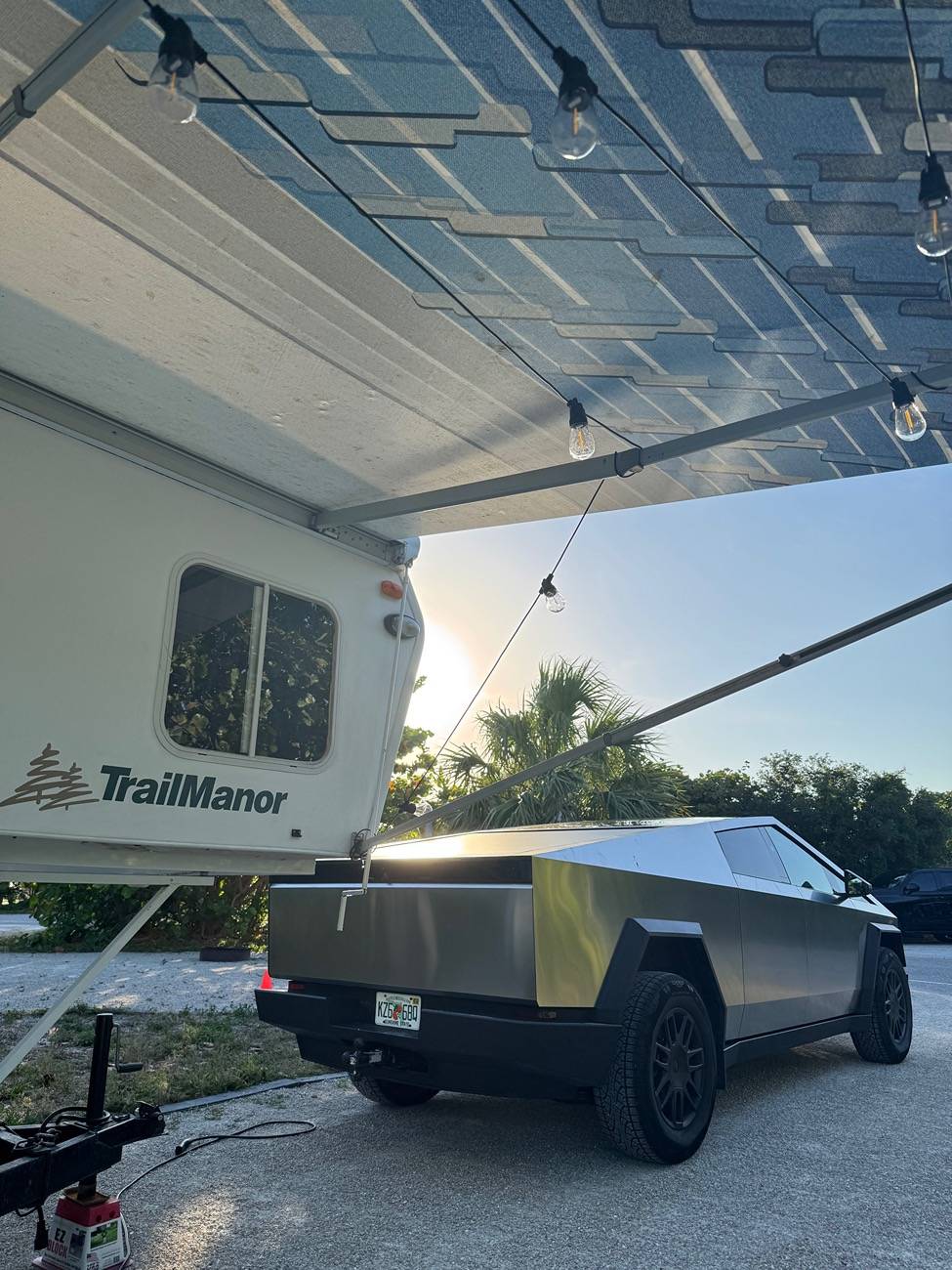 Tesla Cybertruck Just got a Trailmanor hard shell pop up camper -- towing stats IMG_2217