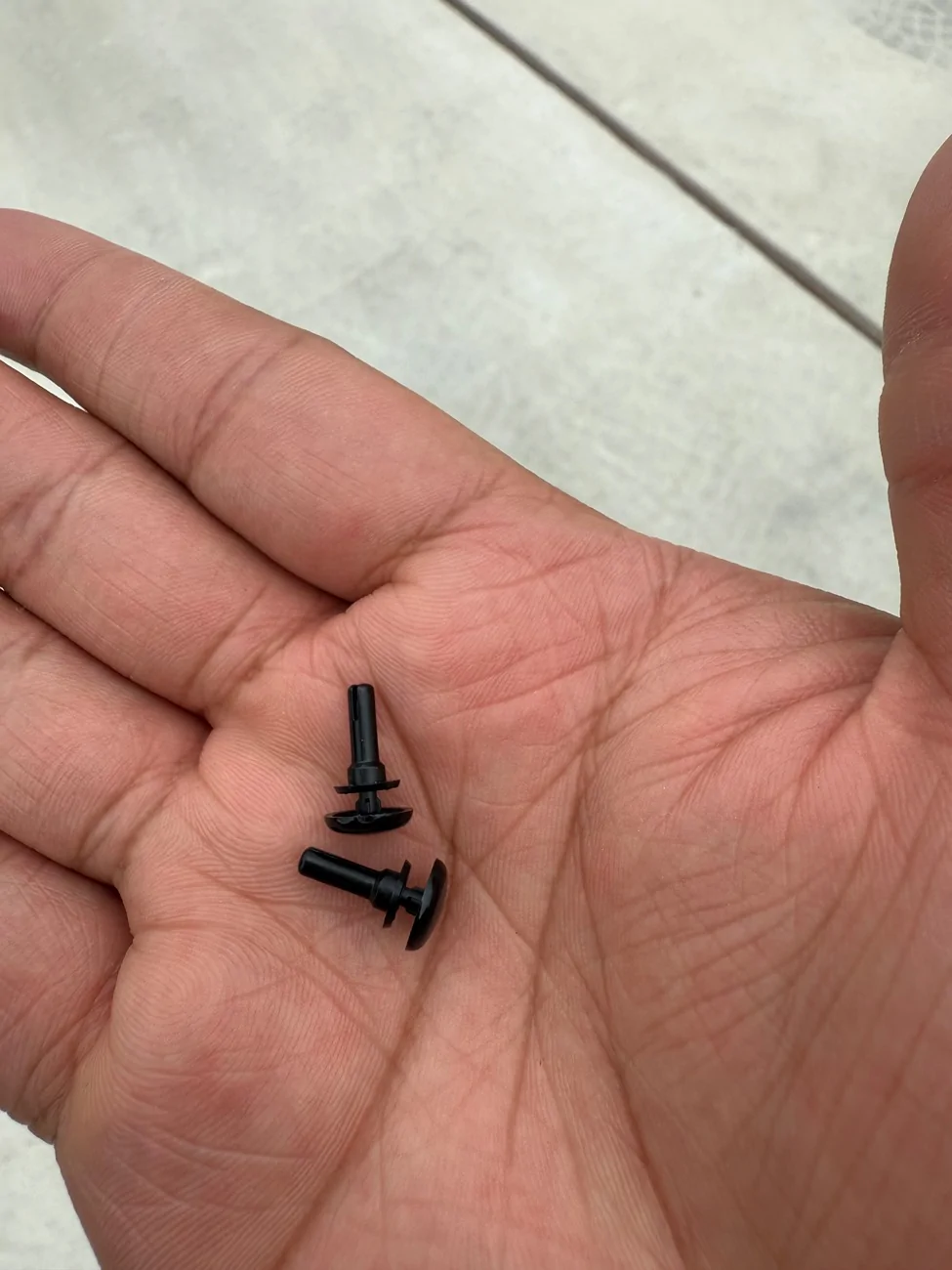 Tesla Cybertruck Pins Under All Weather Mats IMG_4151