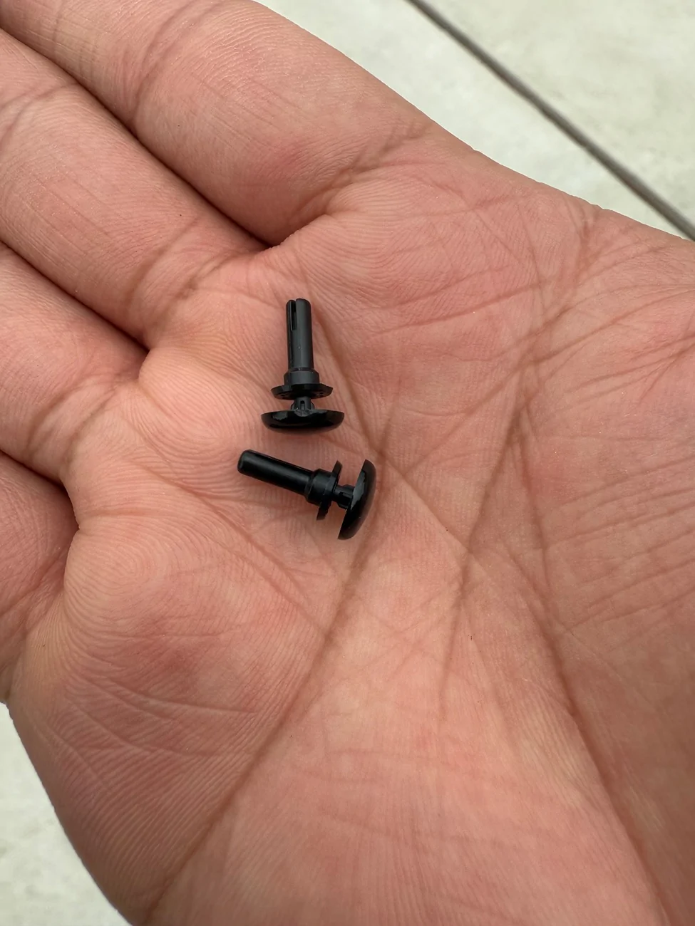 Tesla Cybertruck Pins Under All Weather Mats IMG_4152