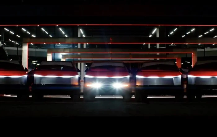 Cybertrucks perform synchronized light show at night