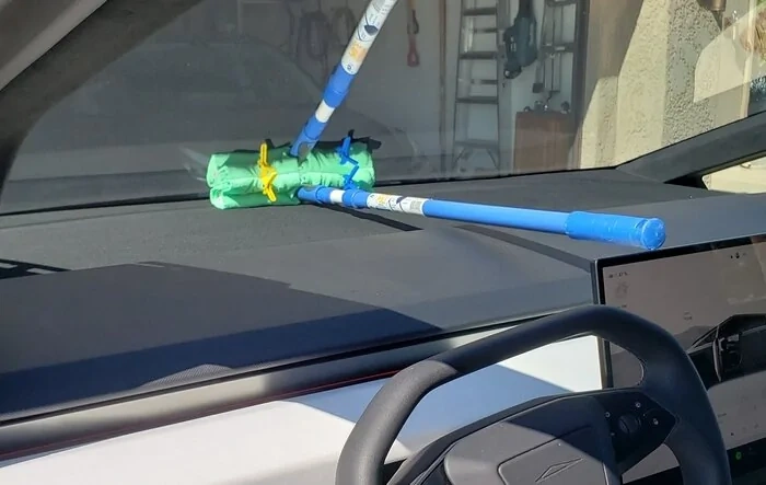 Cleaning inside of windshield -- using window cleaning mop with long handle