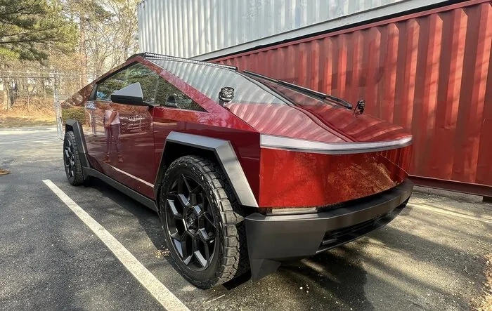 Gloss Red Cybertruck by T Sportline - on 24" wheels, Nitto Recon Grappler tires, cowl lights w/ Morimoto 4Banger LED Pods