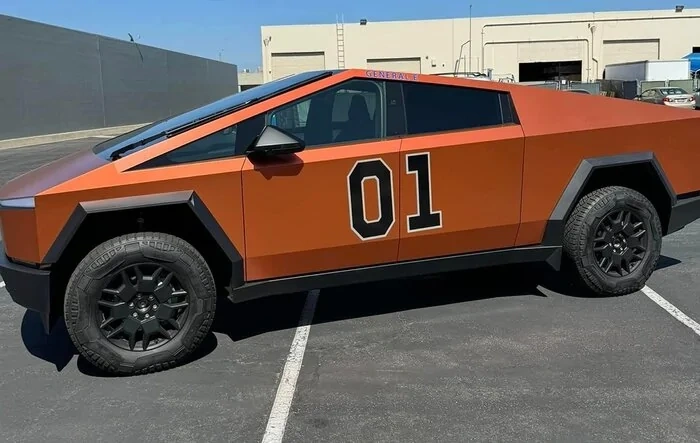 "General E" Cybertruck in wrap inspired by Dukes of Hazzard General Lee (Teckwrap Wild Orange Wrap)