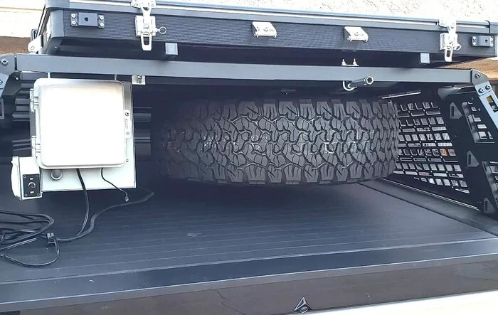 How I Carry a Spare When Off-road Adventuring -- Mounted to Underside of Bed Rack