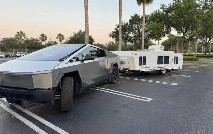 Just got a Trailmanor hard shell pop up camper -- towing stats