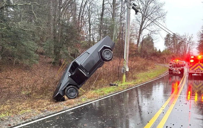 Cybertruck skids off road and dangles on electric pole cable