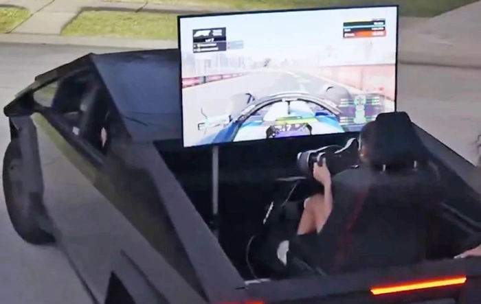 Racing simulator setup in Cybertruck bed