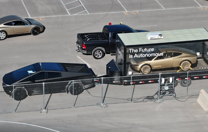 Cybertruck tows a Cybercab & Optimus in display case