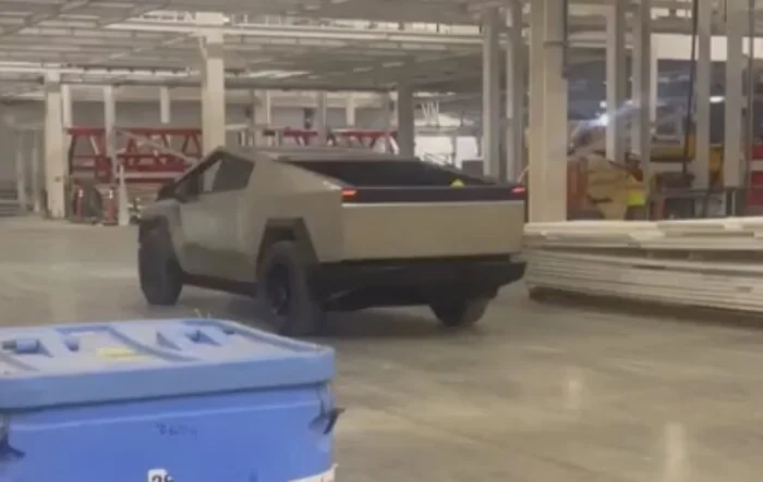 New Video - Cybertruck driving inside Giga Texas and lifted into place for Cyber Roundup 2023