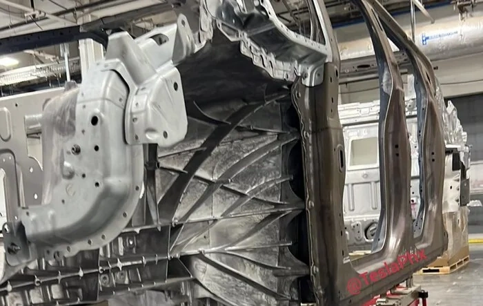 New Body-in-White pic shows front wheel well, front quarter window + more